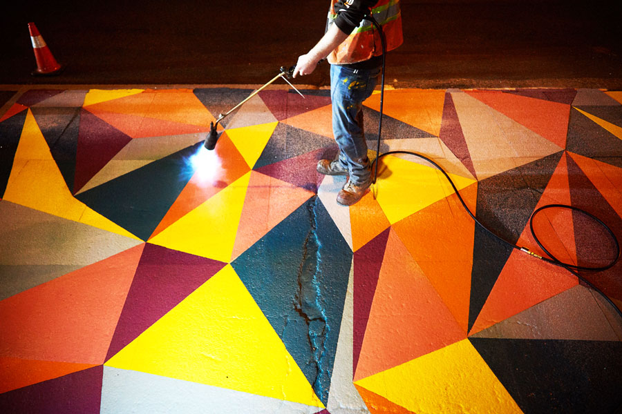 Applying colourful pavement coating