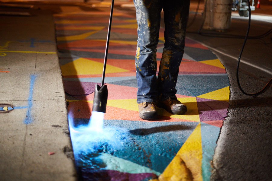 Applying colourful pavement coating